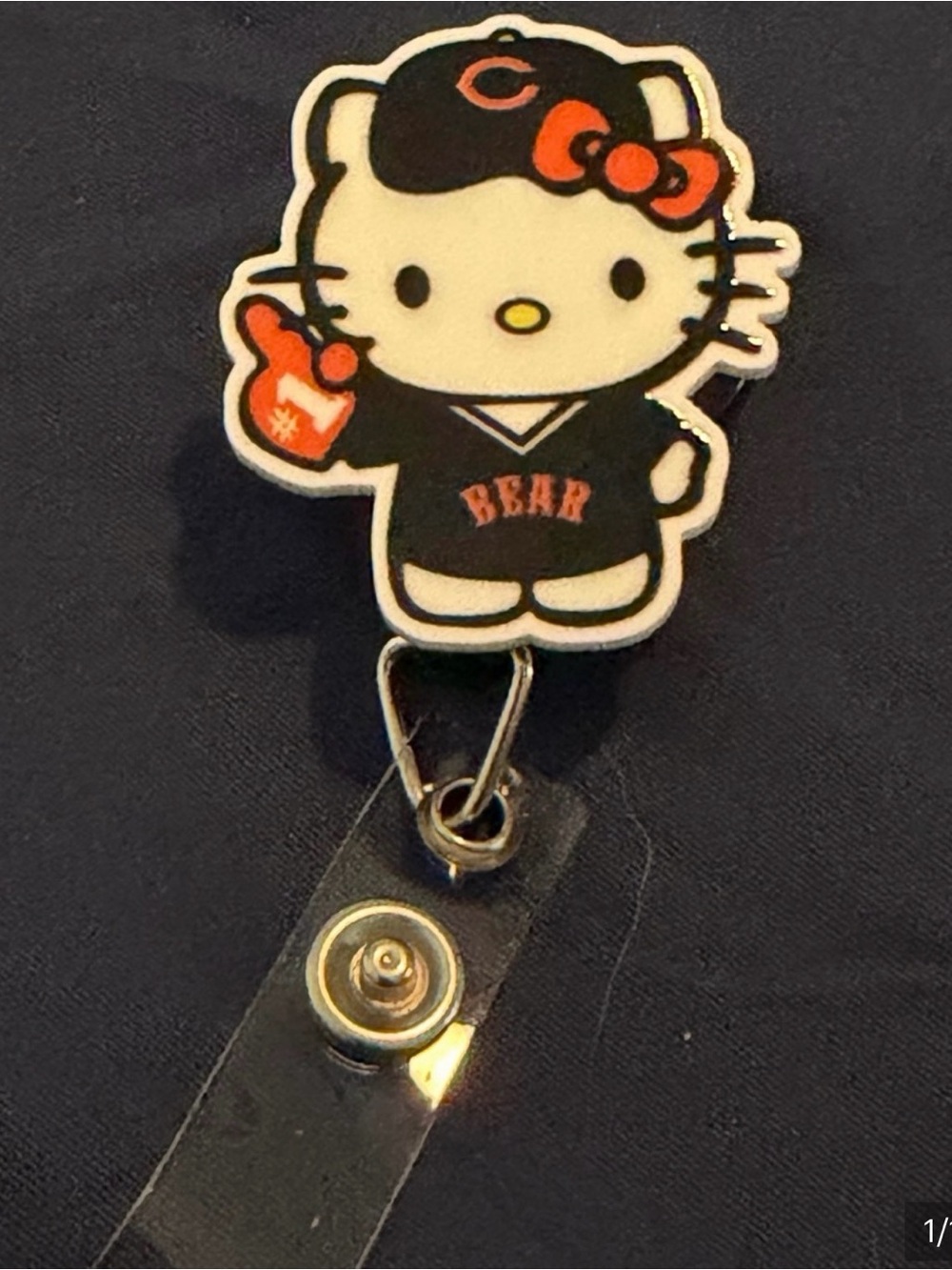 Hello Kitty Black & Orange Team Badge Reel